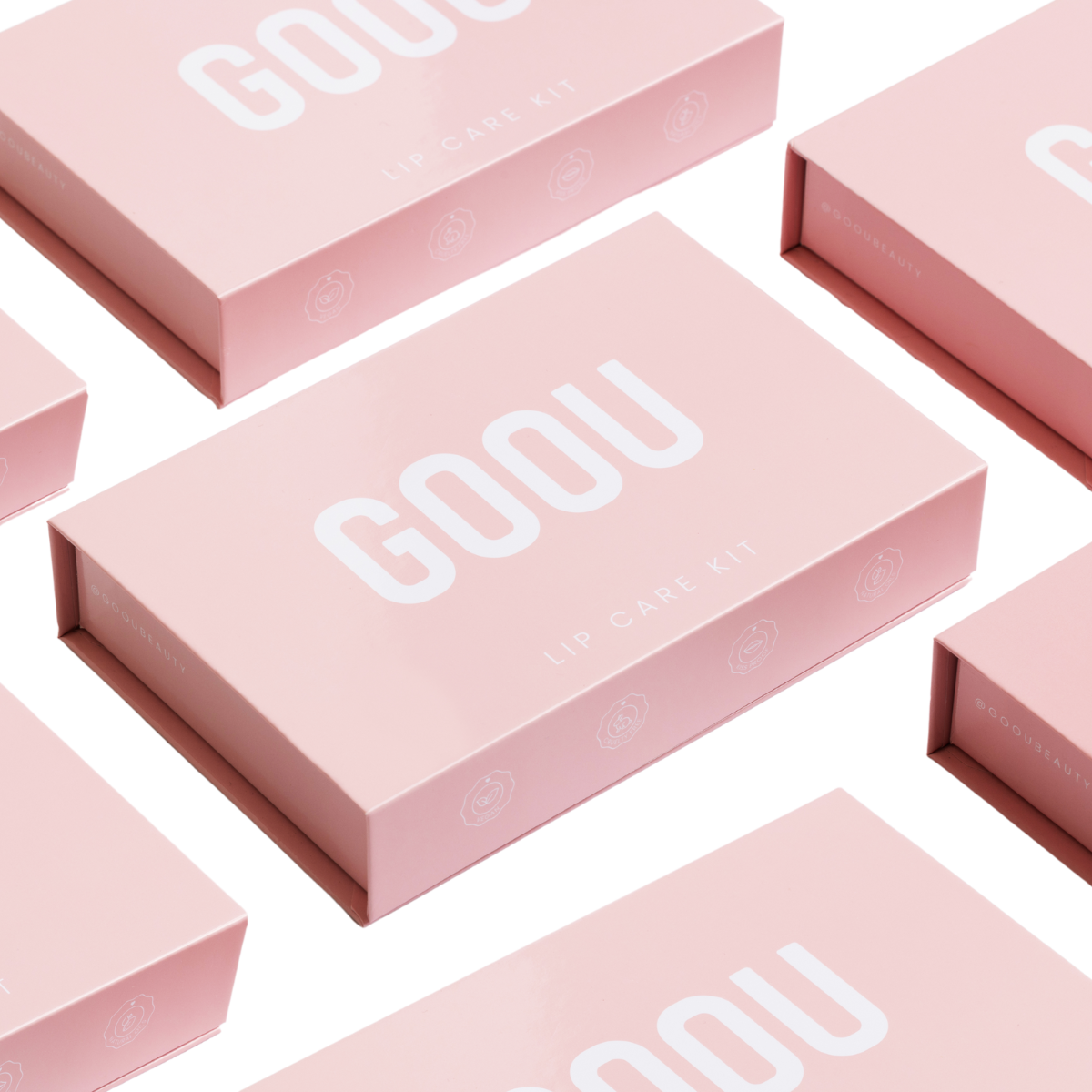 Goou beauty lip care lip kit pink box packaging including a lip oil, lip scrub and lip mask balm