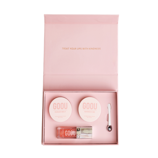 Goou beauty lip care lip kit with pink box packaging including a lip oil, lip scrub and lip mask balm on white background